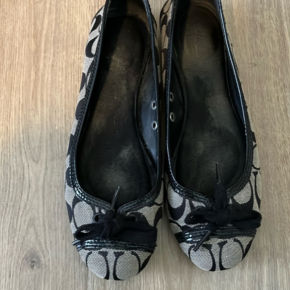 Coach flats lightly worn has cushion insert in them.